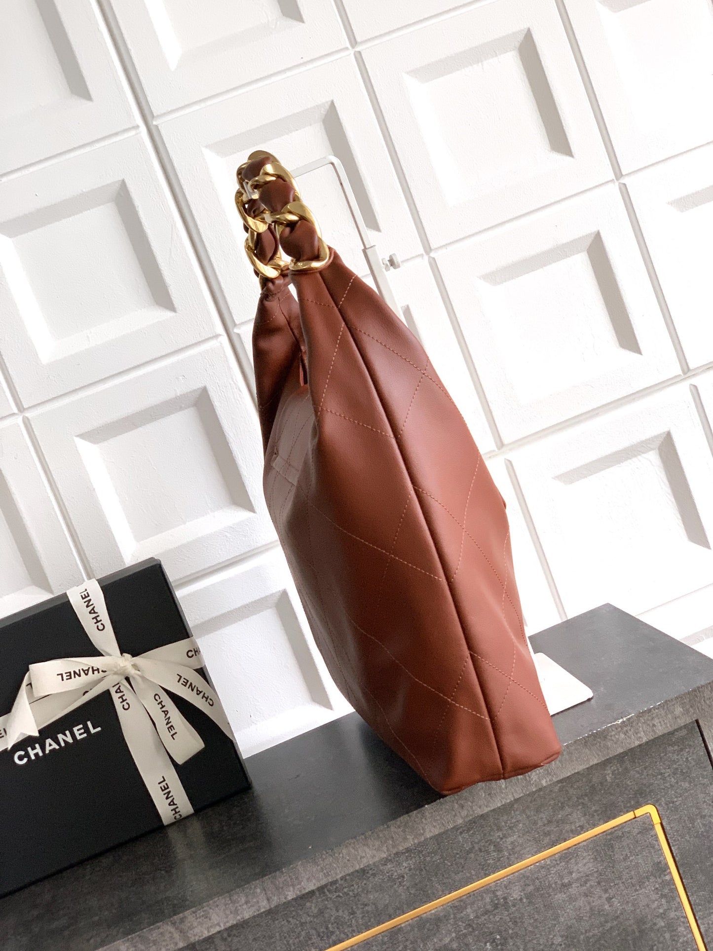 ** Burgundy Leather Hobo Bag with Gold Chain - Stylish & Versatile

**