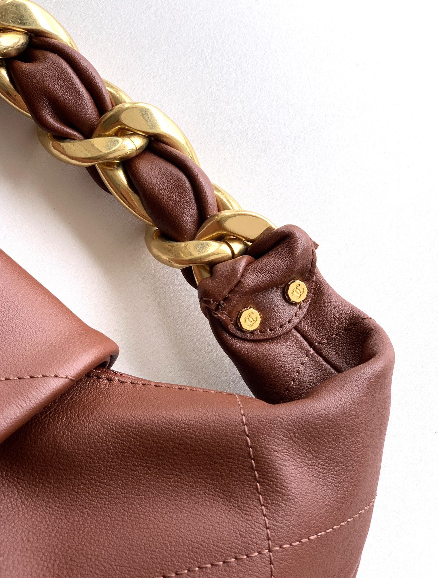 ** Burgundy Leather Hobo Bag with Gold Chain - Stylish & Versatile

**